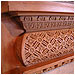 Ornate Wooden Fireplace with Marble Inlay